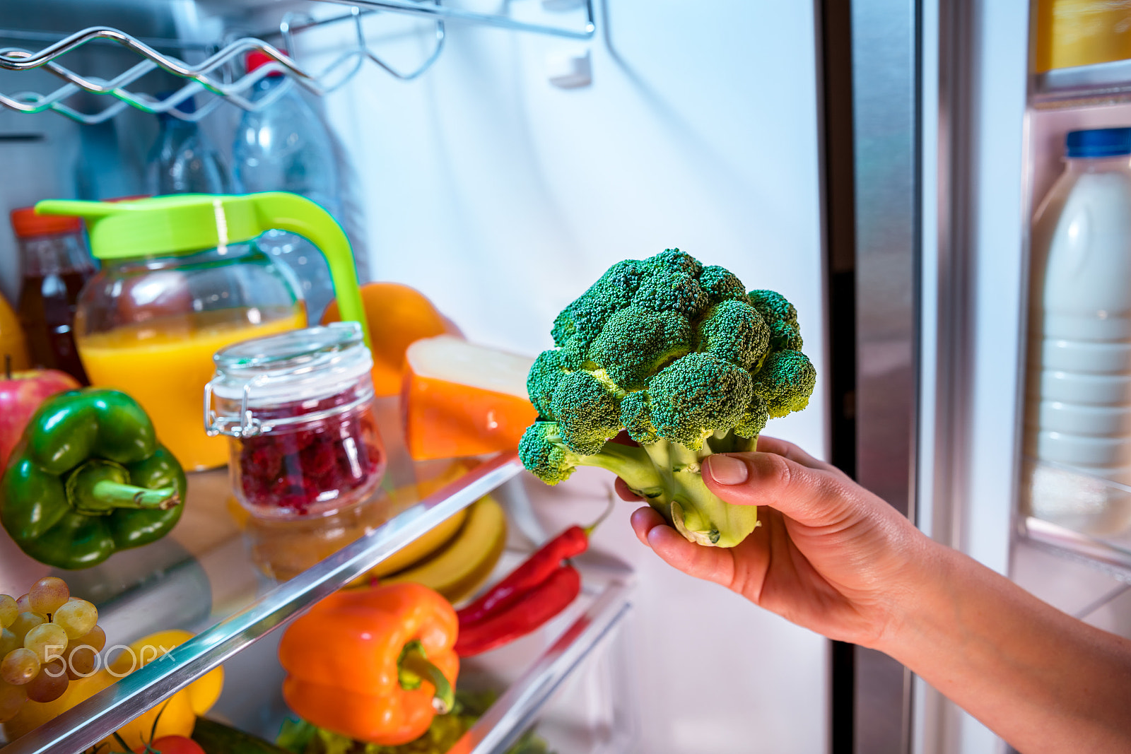 Canon EF 24-70mm F2.8L II USM sample photo. Woman takes the broccoli from the open refrigerator. photography
