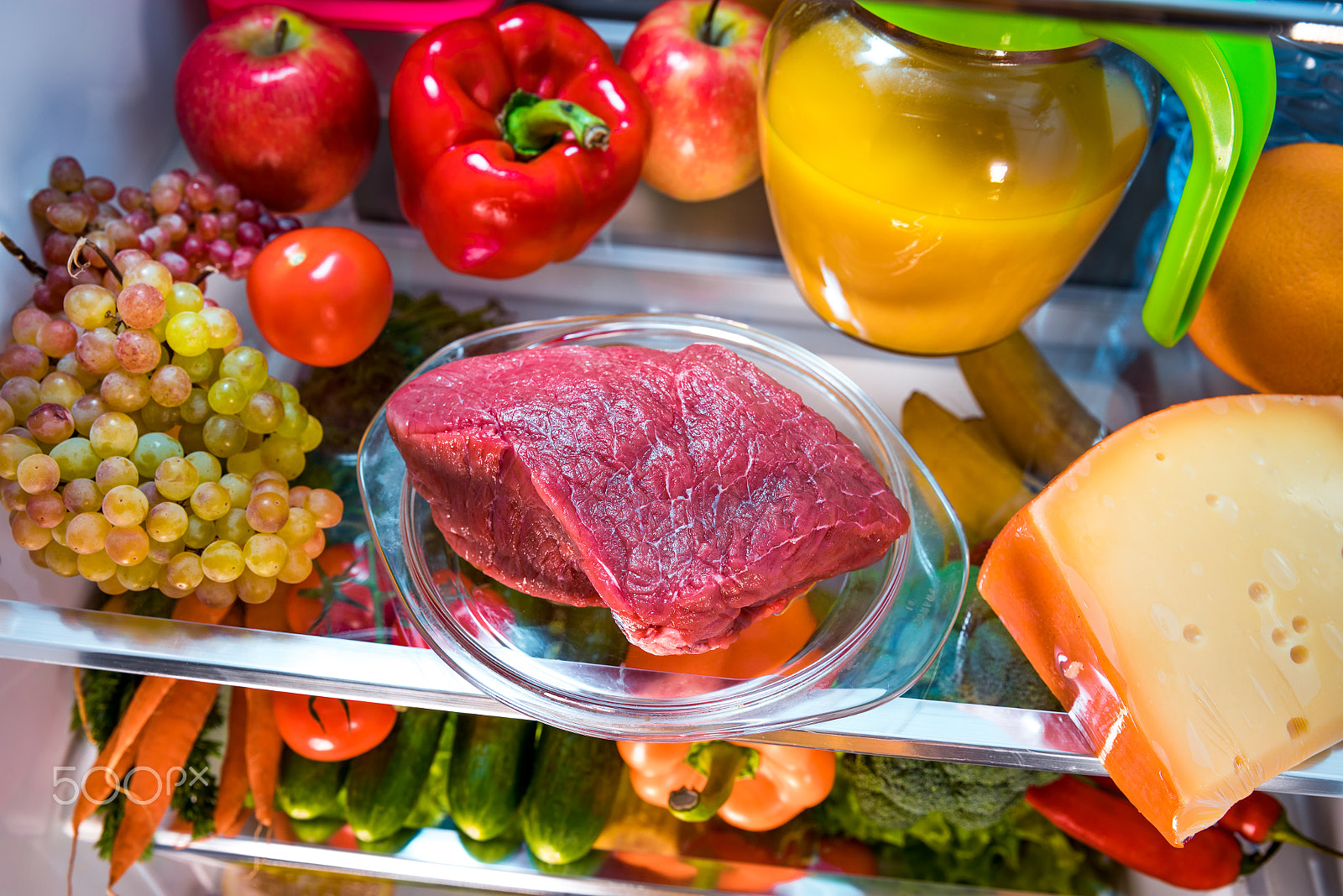 Canon EF 24-70mm F2.8L II USM sample photo. Fresh raw meat on a shelf open refrigerator photography