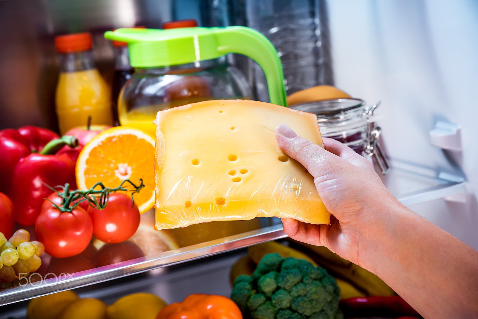Canon EF 24-70mm F2.8L II USM sample photo. Woman takes the piece of cheese from the open refrigerator photography