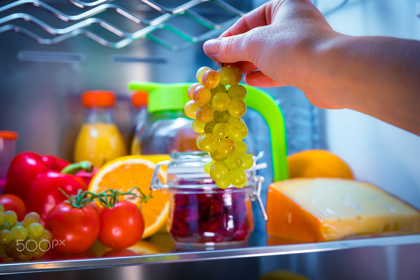 Canon EF 24-70mm F2.8L II USM sample photo. Woman takes the bunch of grapes from the open refrigerator photography