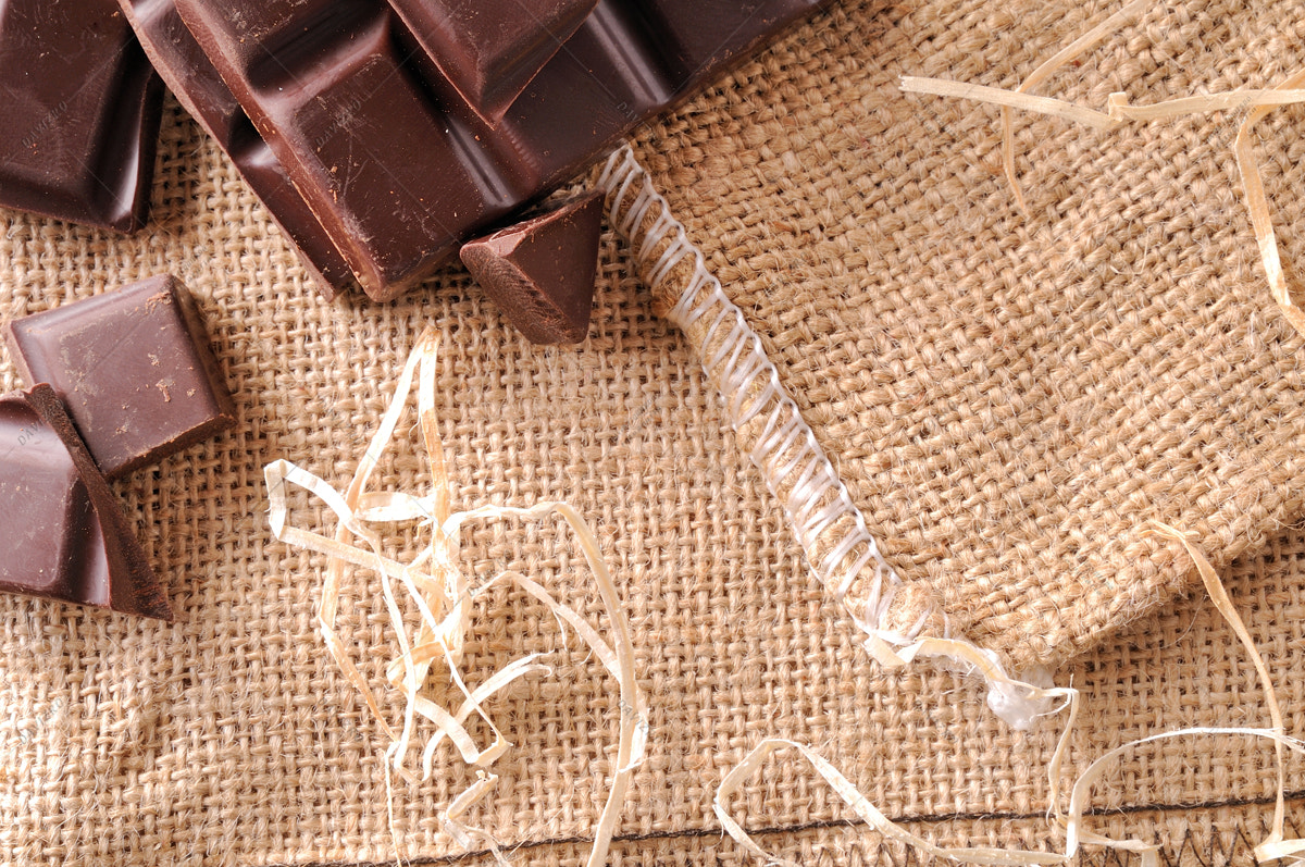 Tamron SP 24-70mm F2.8 Di VC USD sample photo. Heap of artisan portions chocolate on burlap top view photography