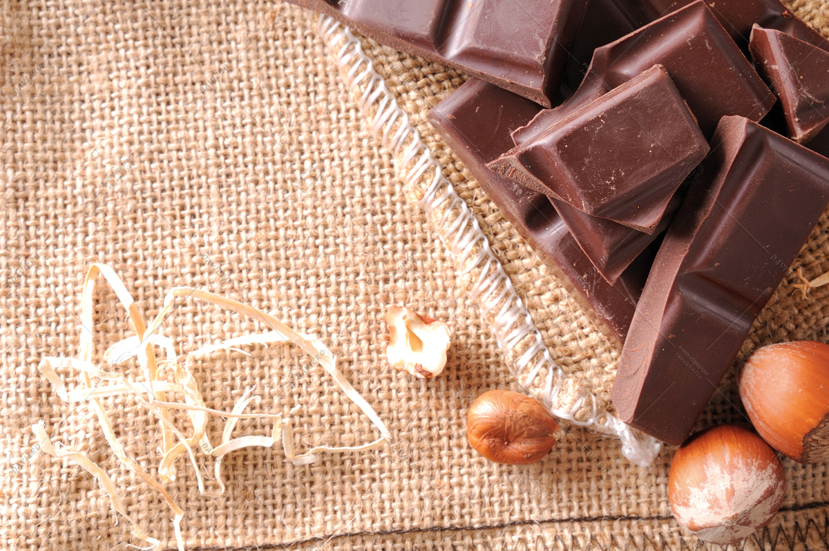 Tamron SP 24-70mm F2.8 Di VC USD sample photo. Heap of artisan portions chocolate with hazelnuts top view photography