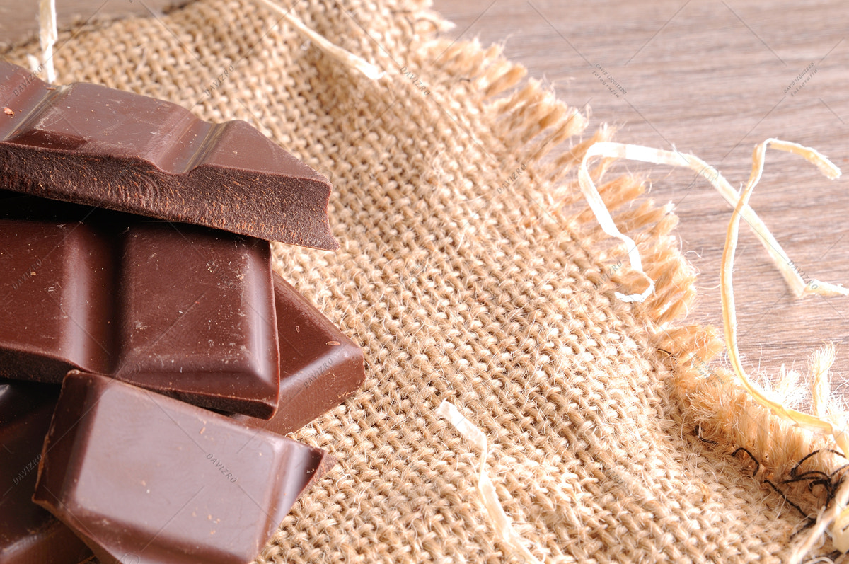 Tamron SP 24-70mm F2.8 Di VC USD sample photo. Heap of artisan portions chocolate on burlap elevated top view photography