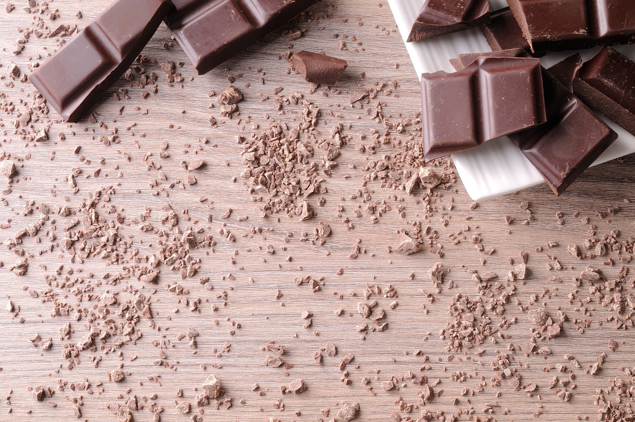 Tamron SP 24-70mm F2.8 Di VC USD sample photo. Portions and sparse chocolate chips on wood table top view photography
