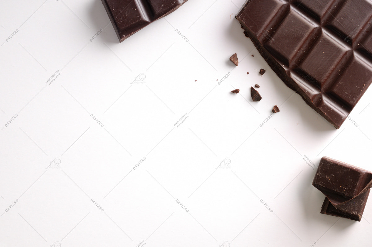 Tamron SP 24-70mm F2.8 Di VC USD sample photo. Broken chocolate bar isolated top view photography