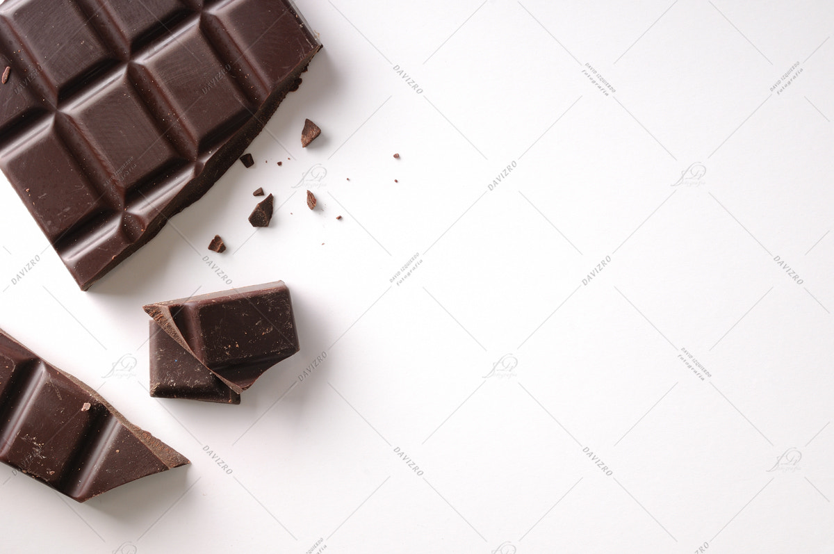 Tamron SP 24-70mm F2.8 Di VC USD sample photo. Broken chocolate bar left position isolated top view photography
