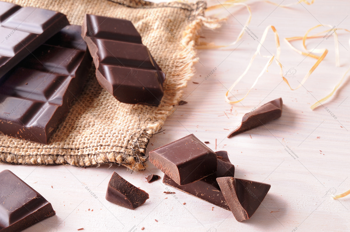 Tamron SP 24-70mm F2.8 Di VC USD sample photo. Broken tablet artisan chocolate on wooden table elevated view photography