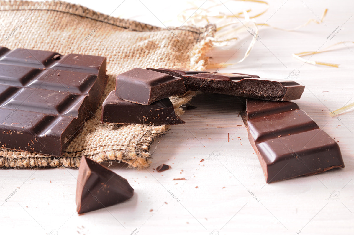 Tamron SP 24-70mm F2.8 Di VC USD sample photo. Broken tablet artisan chocolate on a wooden table elevated view photography