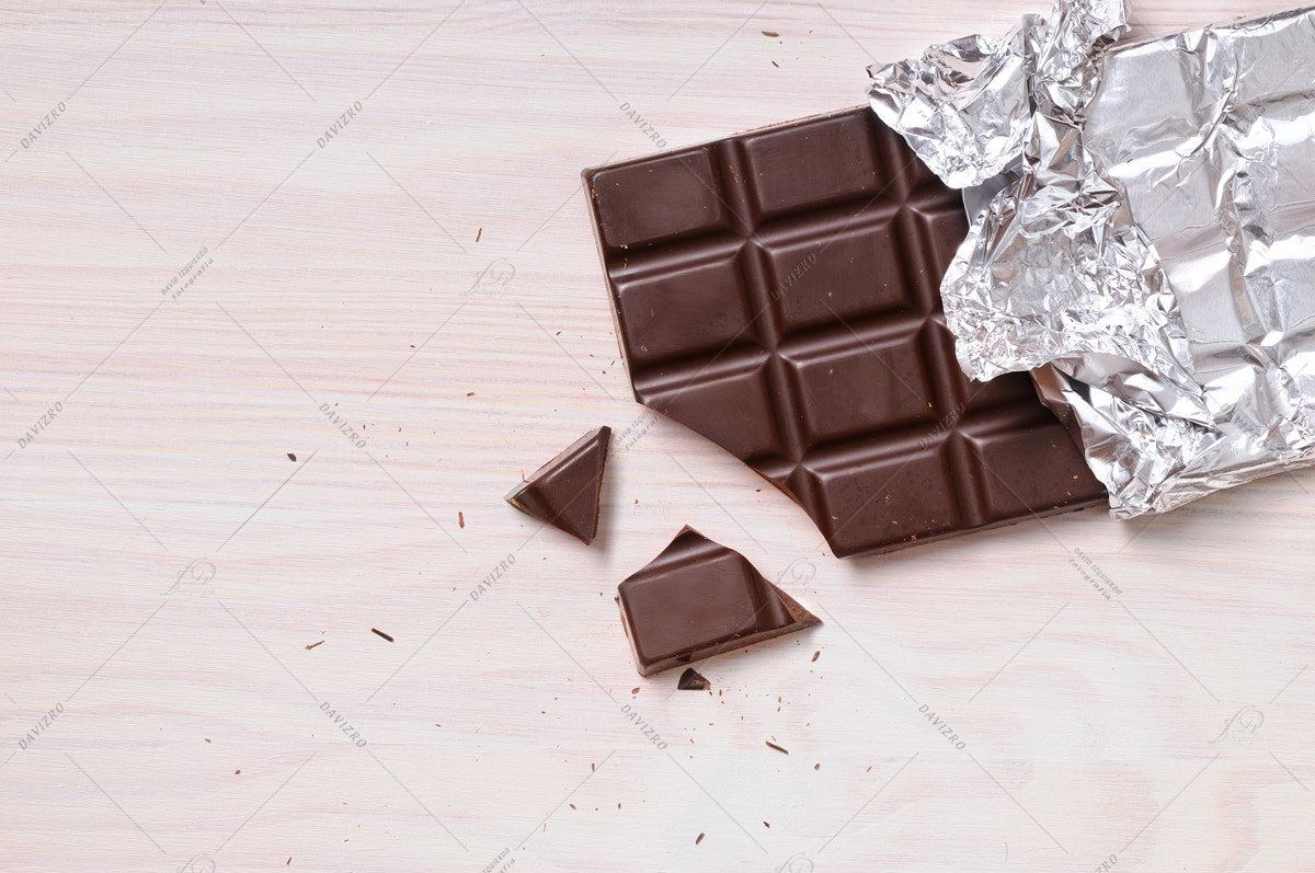 Tamron SP 24-70mm F2.8 Di VC USD sample photo. Detail of chocolate bar with silver wrapping top view photography