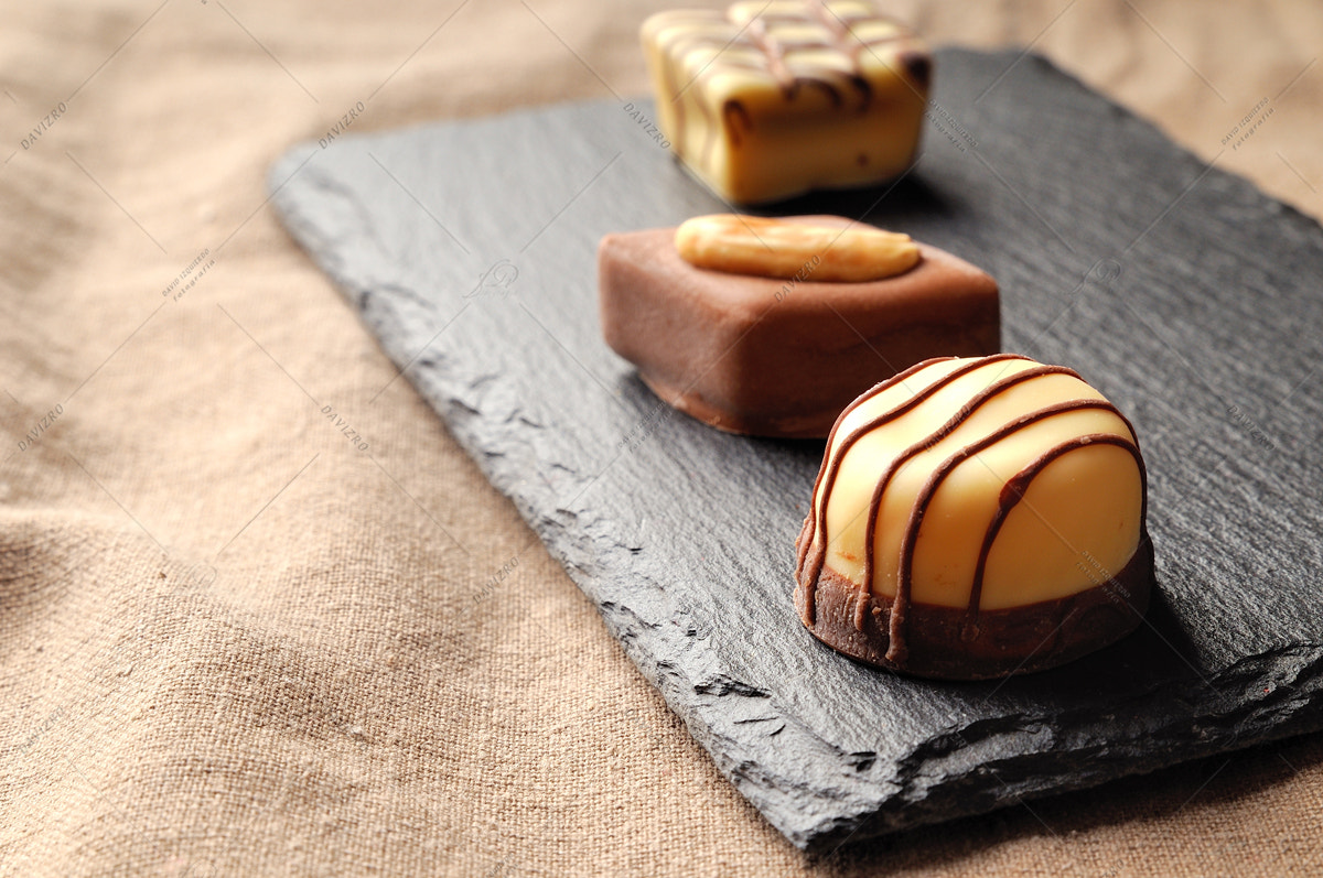 Tamron SP 24-70mm F2.8 Di VC USD sample photo. Assorted bonbons on a slate plate close up photography