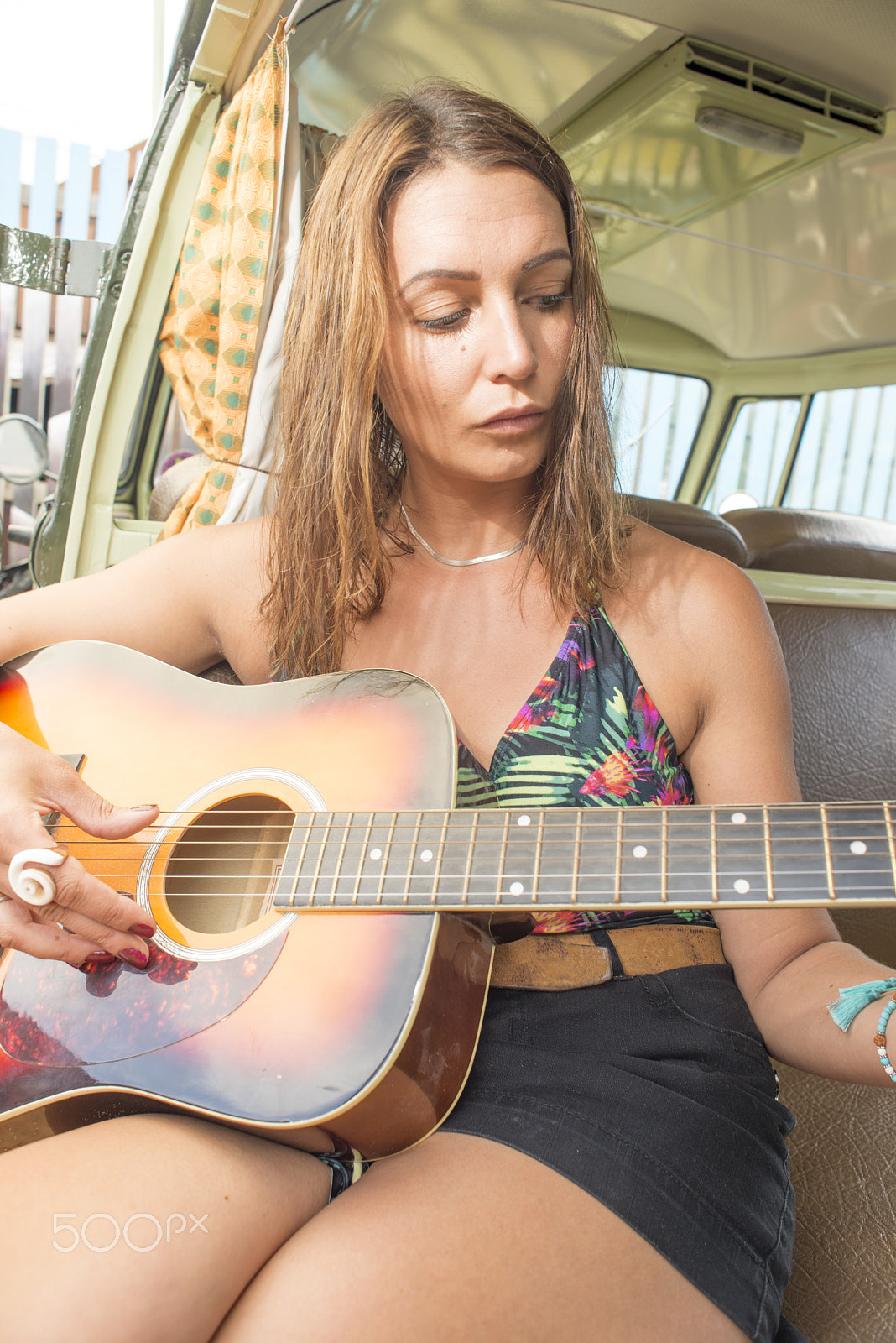 Nikon D600 + Nikon AF Nikkor 24mm F2.8D sample photo. Young woman plays guitar in combi van photography