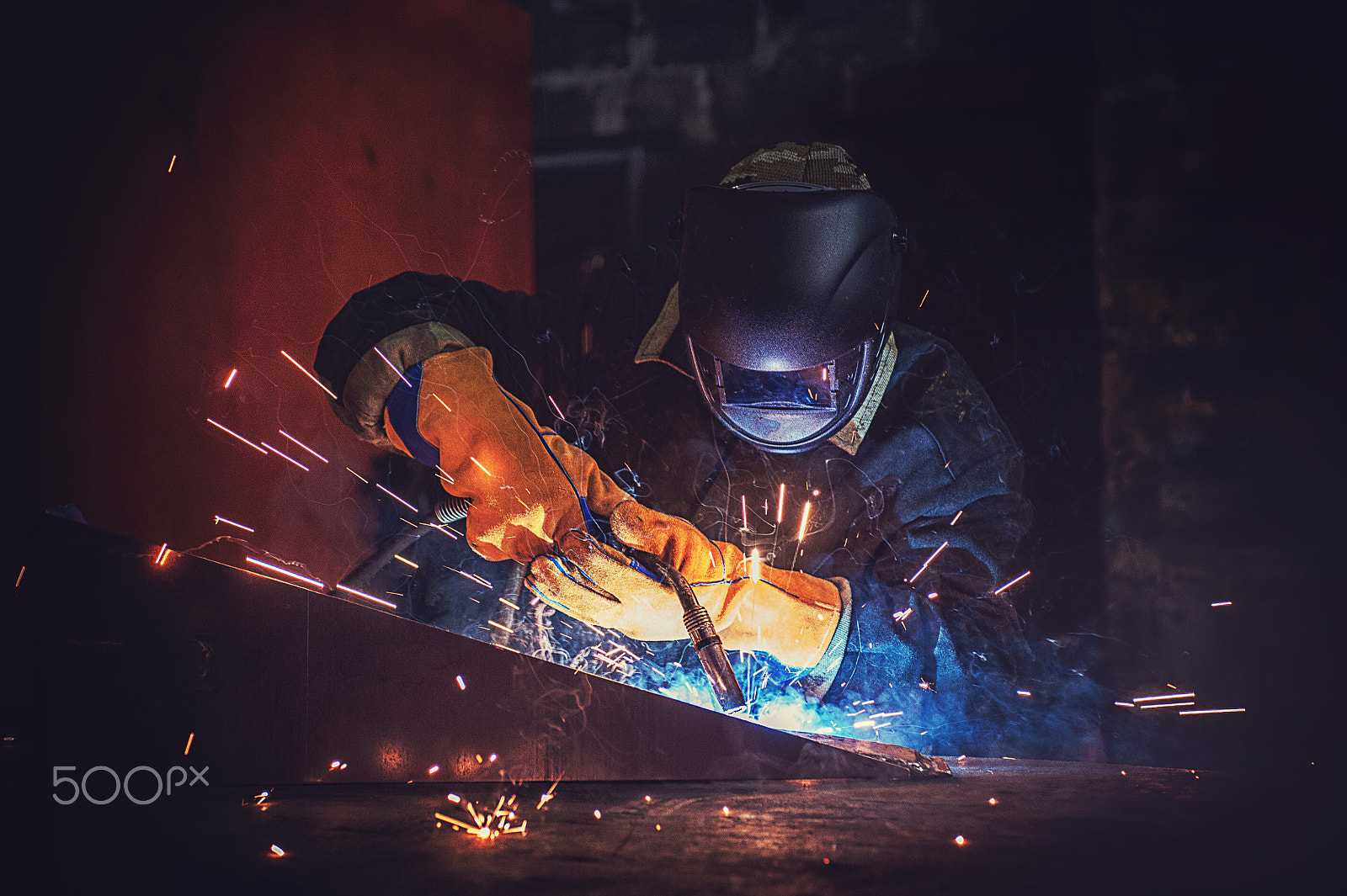Nikon AF-S Nikkor 28-70mm F2.8 ED-IF sample photo. Worker welding metal photography