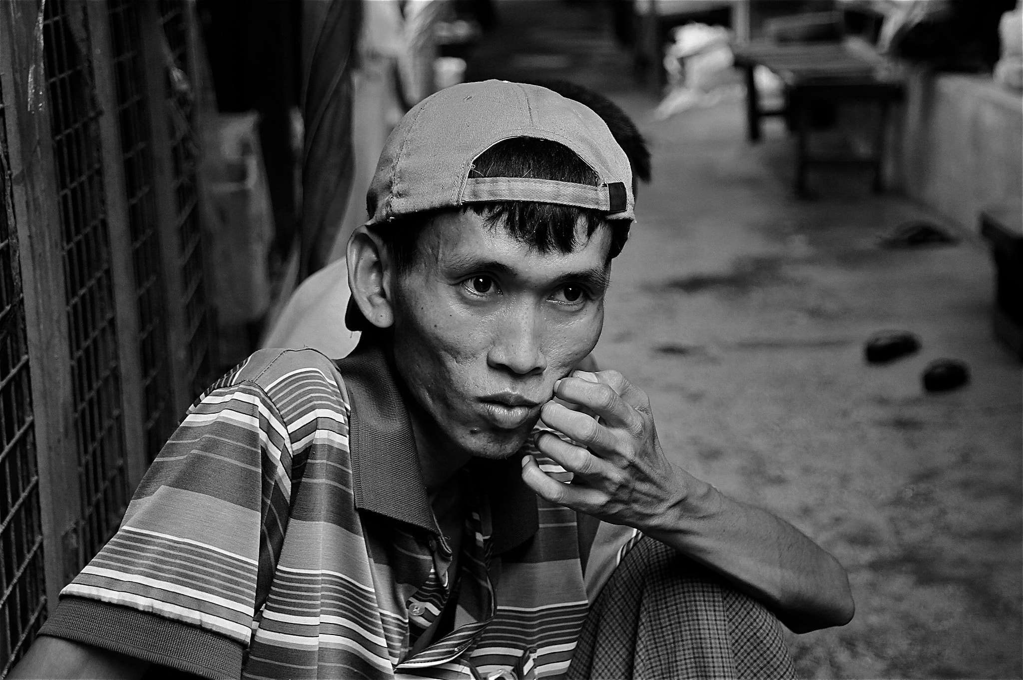 Sony SLT-A33 sample photo. Burma 109 (faces of burma) a pair of black shoes photography