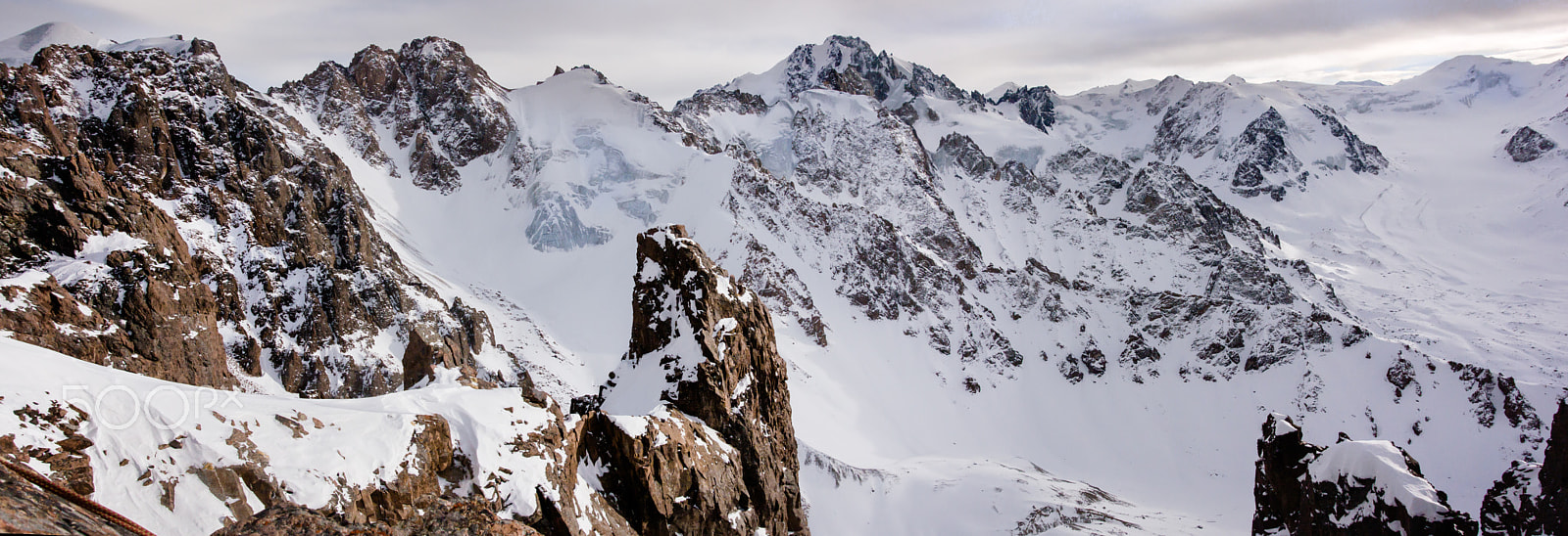 Nikon 1 AW1 sample photo. Rocks, ice, snow and gray sky ... photography