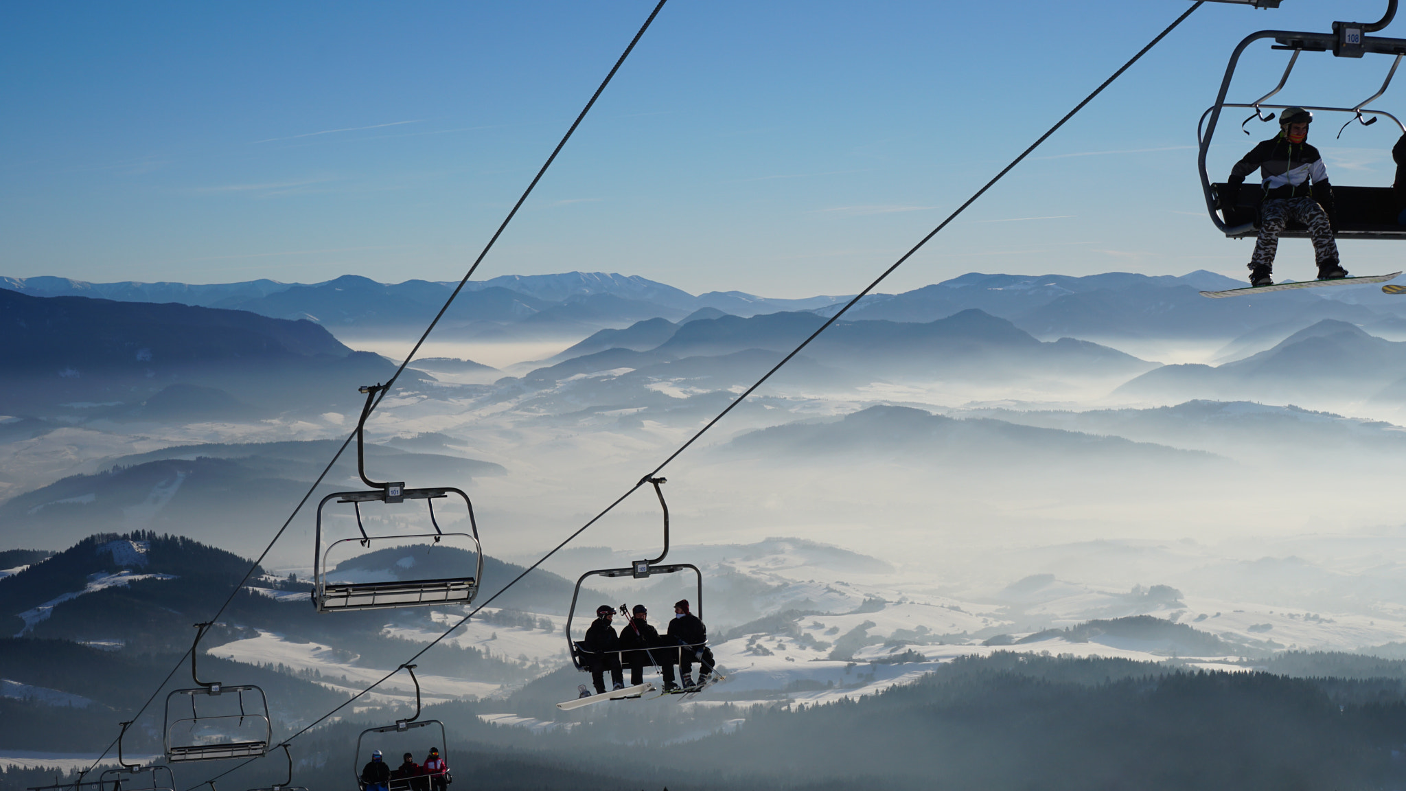 Sony a6500 + Sony E 35mm F1.8 OSS sample photo. Snowy chairlift photography