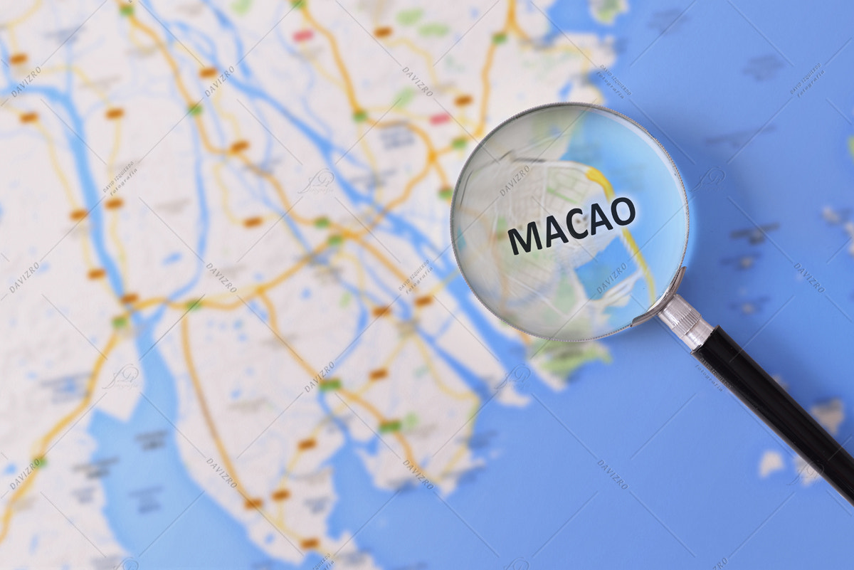 Consultation with magnifying glass map of Macao