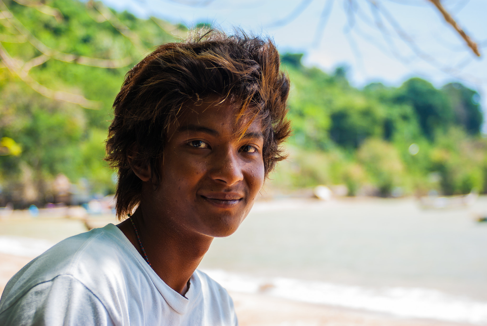 Pentax K10D sample photo. A shy smile of a young man from thailand photography