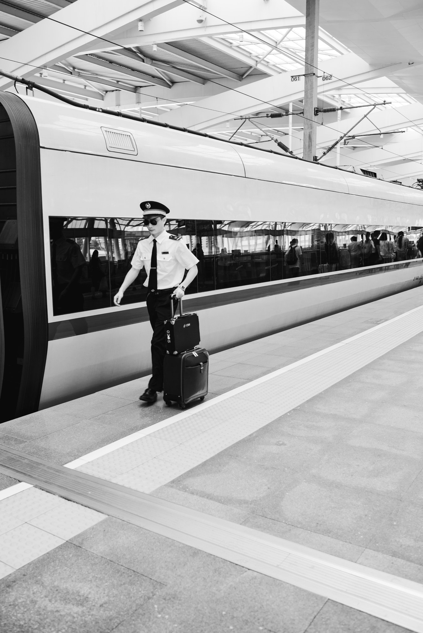 Nikon D800E + Nikon AF-S Nikkor 28mm F1.8G sample photo. Young high-speed rail conductor photography