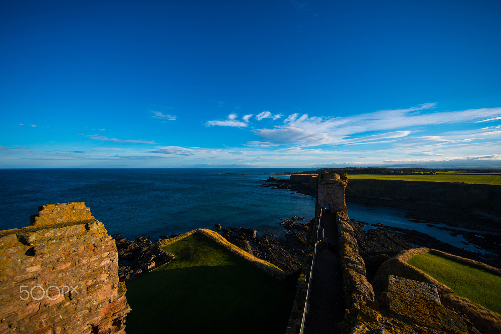 Nikon D500 sample photo. Castle ruins rising above coastal cliffs photography