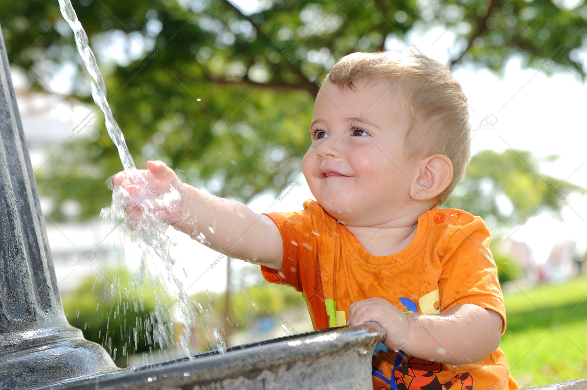 Tamron SP 24-70mm F2.8 Di VC USD sample photo. Blonde boy playing with water fountain photography