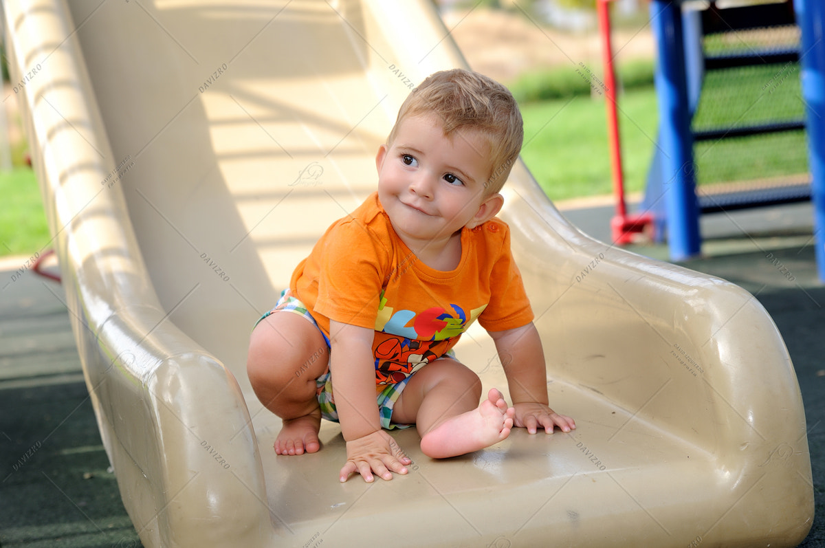Tamron SP 24-70mm F2.8 Di VC USD sample photo. Little blond boy on a slide in the park photography