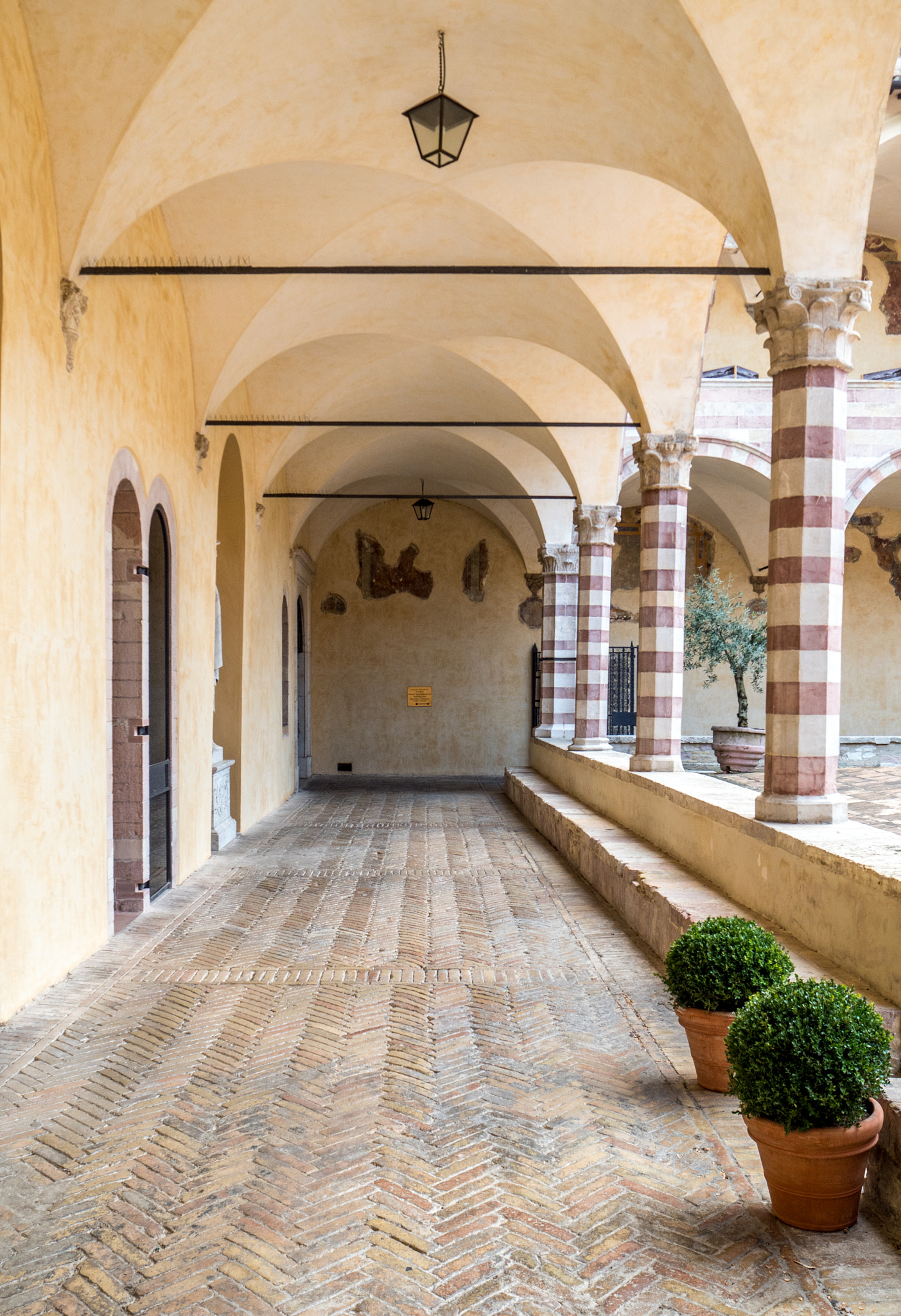 Olympus PEN-F sample photo. Assisi basilica interior walkway photography