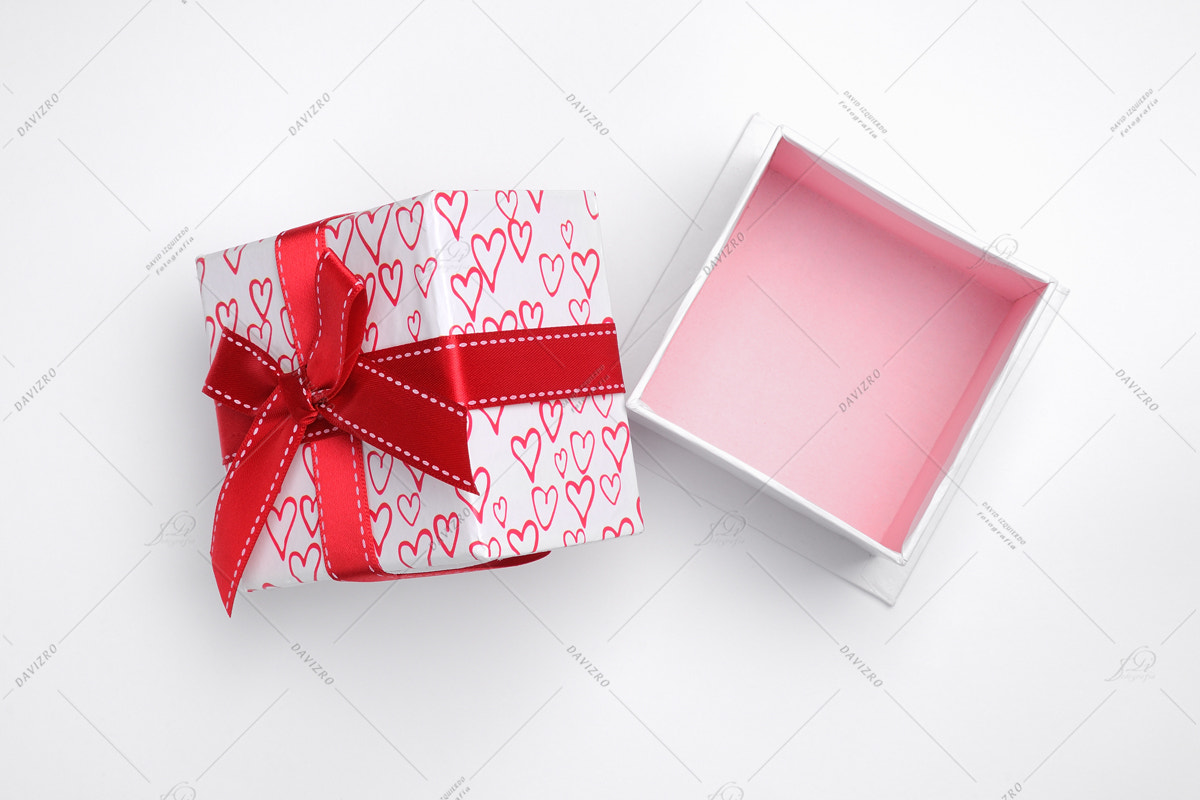 Tamron SP 24-70mm F2.8 Di VC USD sample photo. Open white gift box with bow and painted hearts isolated top photography