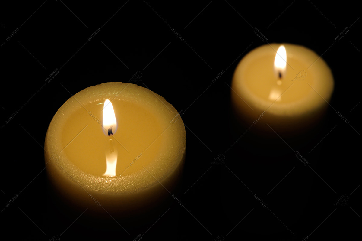Nikon D300 sample photo. Two candles with dark background top view photography