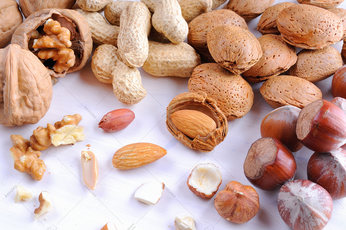 Tamron SP 24-70mm F2.8 Di VC USD sample photo. Nuts in shell and shelled on a table top view photography