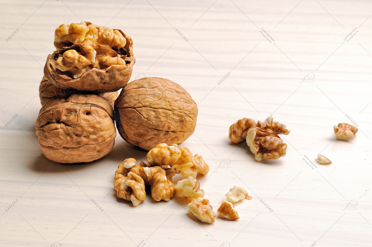 Nikon D300 sample photo. Group of walnuts on a table photography