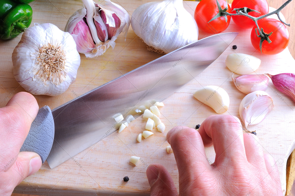 Tamron SP 24-70mm F2.8 Di VC USD sample photo. Chef chopping garlic on a cutting table photography