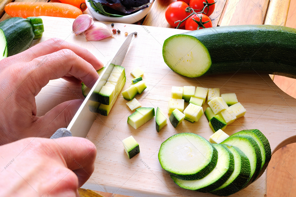 Tamron SP 24-70mm F2.8 Di VC USD sample photo. Chef preparing a green zucchini on a cutting board photography