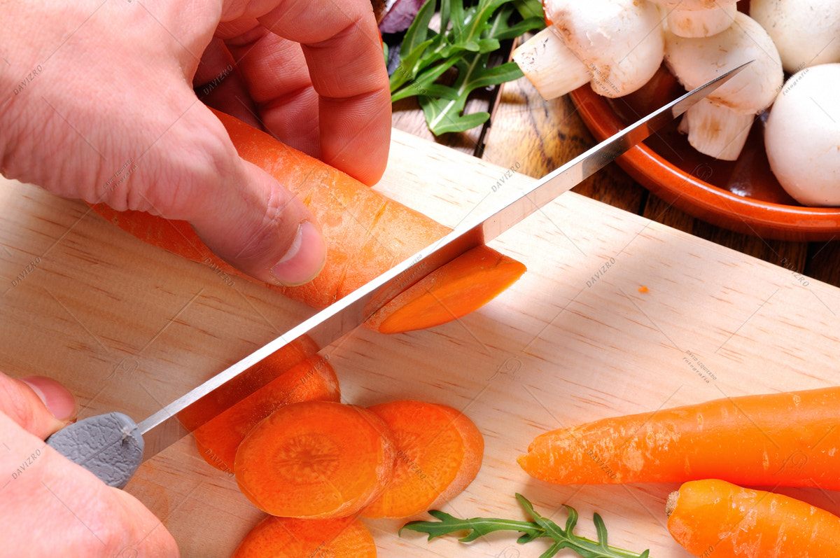 Nikon D300 + Tamron SP 24-70mm F2.8 Di VC USD sample photo. Chef preparing some carrots on a cutting board photography