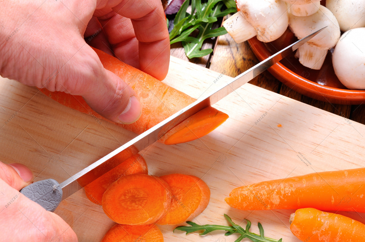 Tamron SP 24-70mm F2.8 Di VC USD sample photo. Chef preparing some carrots on a cutting board photography