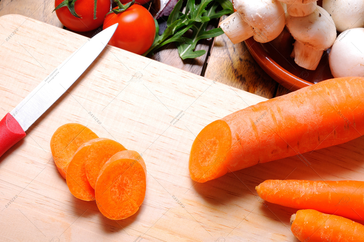 Tamron SP 24-70mm F2.8 Di VC USD sample photo. Carrots on a cutting board in the kitchen table top view photography