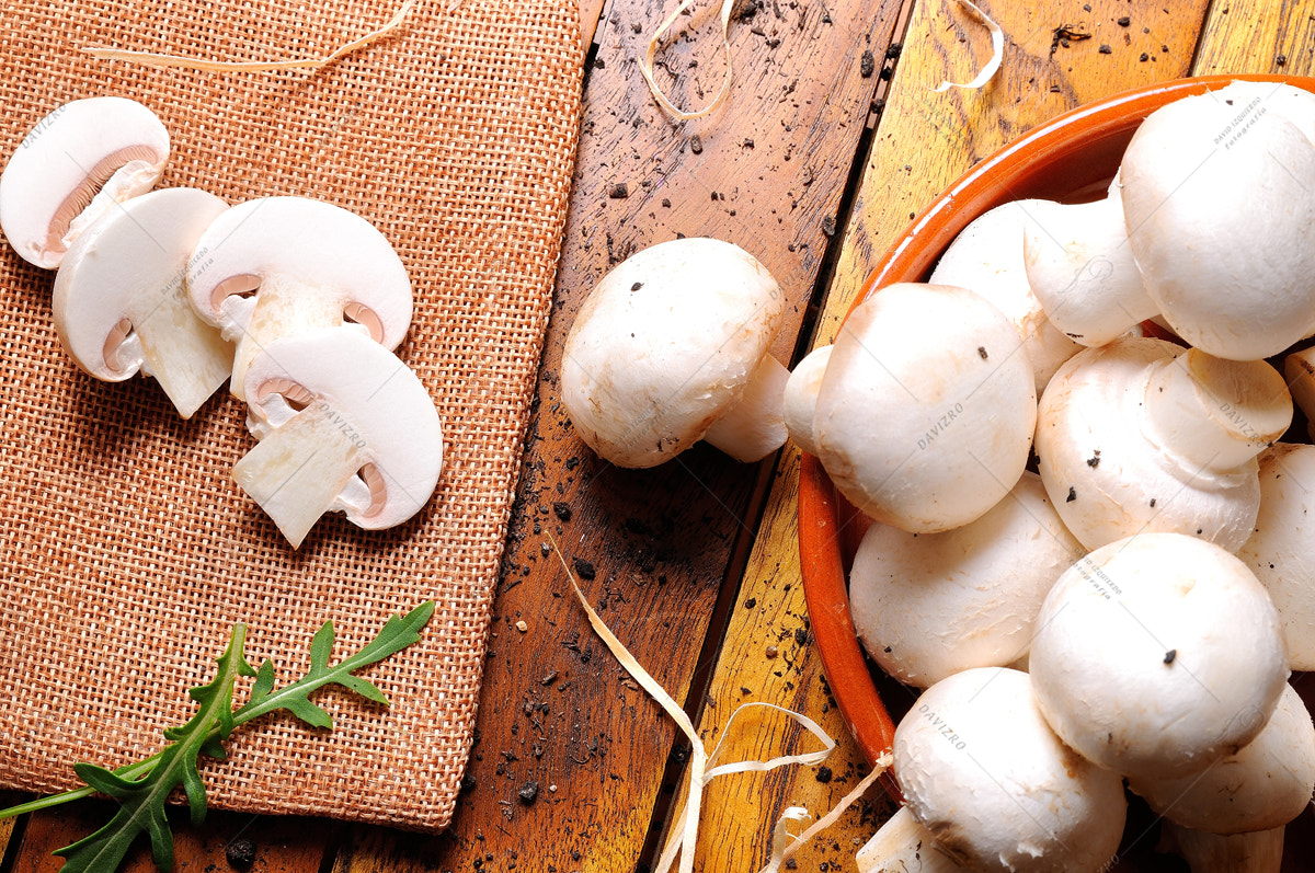 Tamron SP 24-70mm F2.8 Di VC USD sample photo. Freshly picked mushrooms on a table in the field top view photography