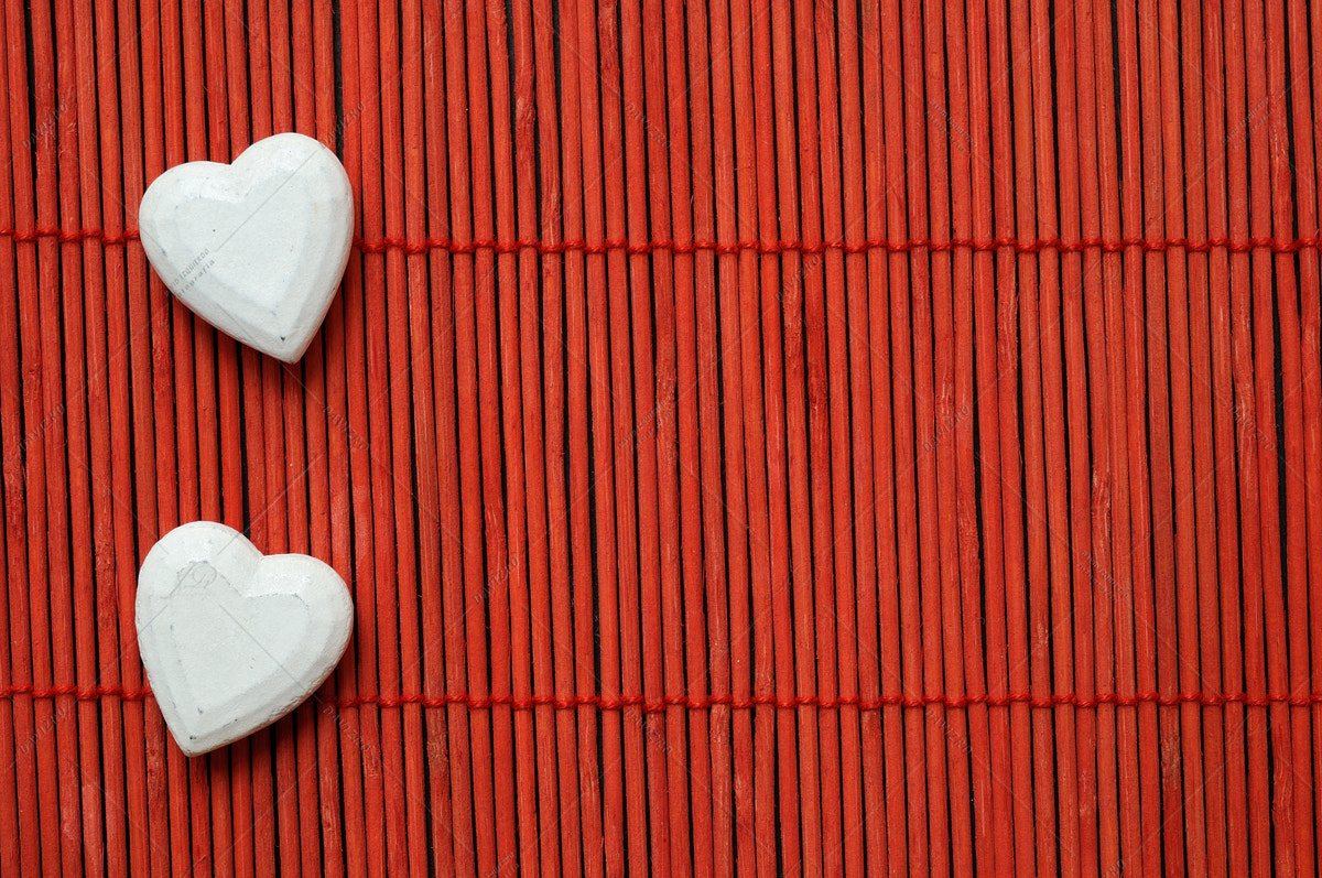 Nikon D300 sample photo. Two hearts on red bamboo lined photography