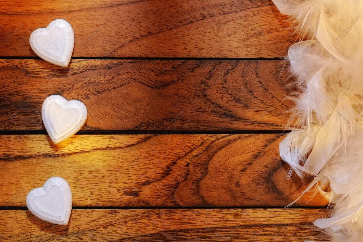 Tamron SP 24-70mm F2.8 Di VC USD sample photo. Three white hearts misaligned and feathers photography