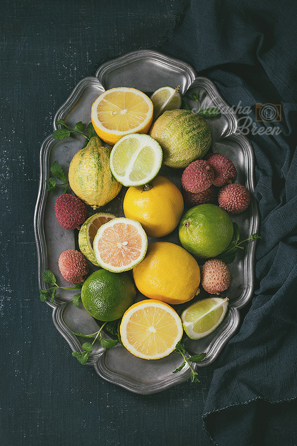 Canon EOS 700D (EOS Rebel T5i / EOS Kiss X7i) + Canon EF 70-200mm F4L IS USM sample photo. Variety of citrus fruits with tiger lemon photography