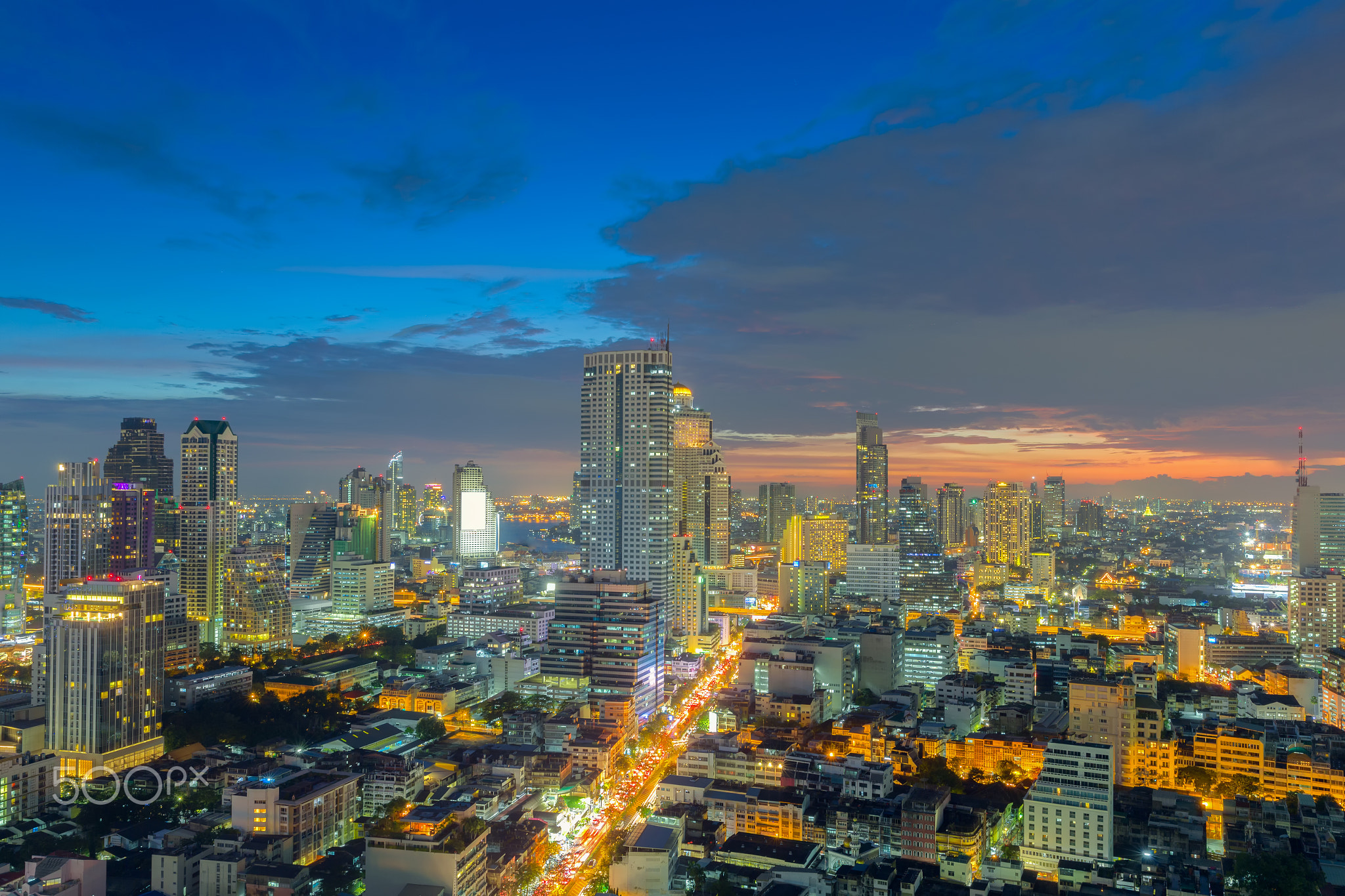 View of Bangkok modern office buildings, condominium in Bangkok city downtown with sunset sky...