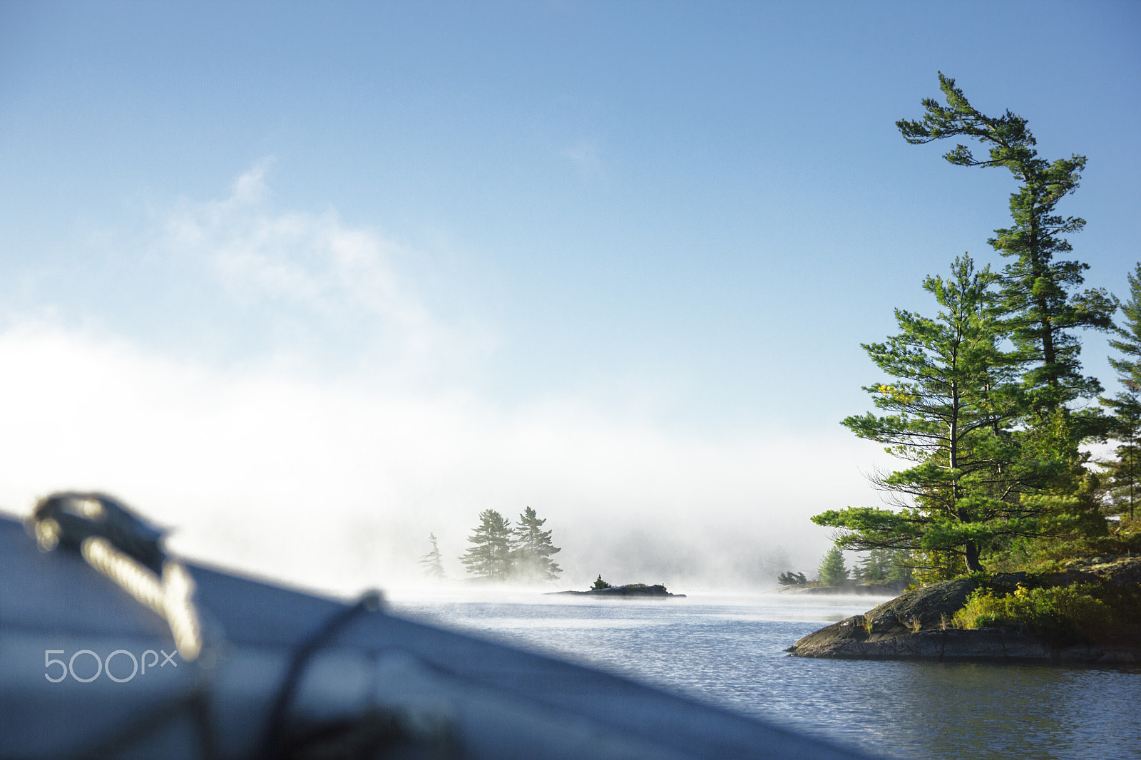 Canon EOS 550D (EOS Rebel T2i / EOS Kiss X4) sample photo. Boat navigating trough lake islands photography