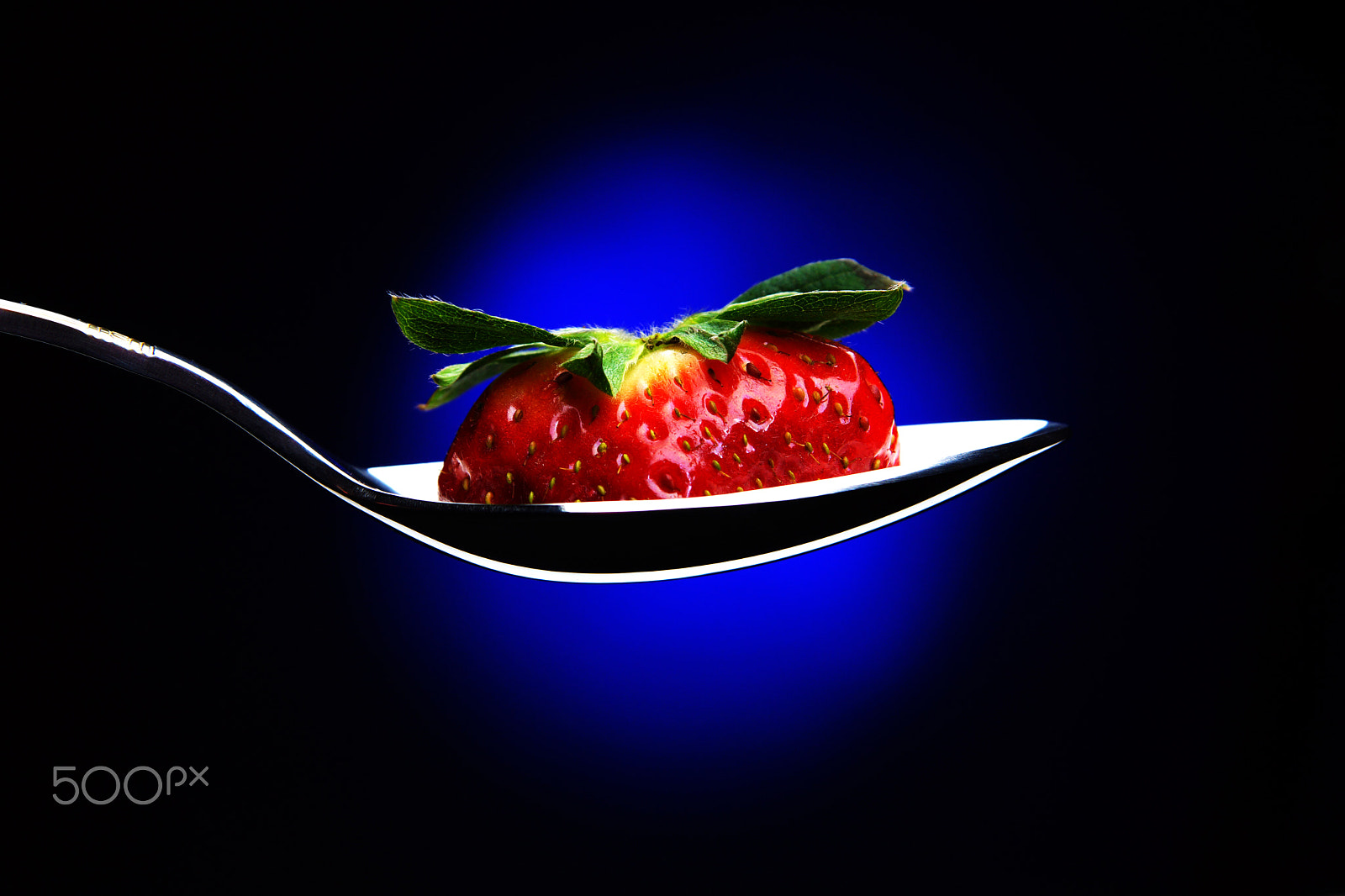 Sony SLT-A65 (SLT-A65V) sample photo. Spoon with a slice of ripe strawberries with a peduncle, background with blue backlight, soap... photography
