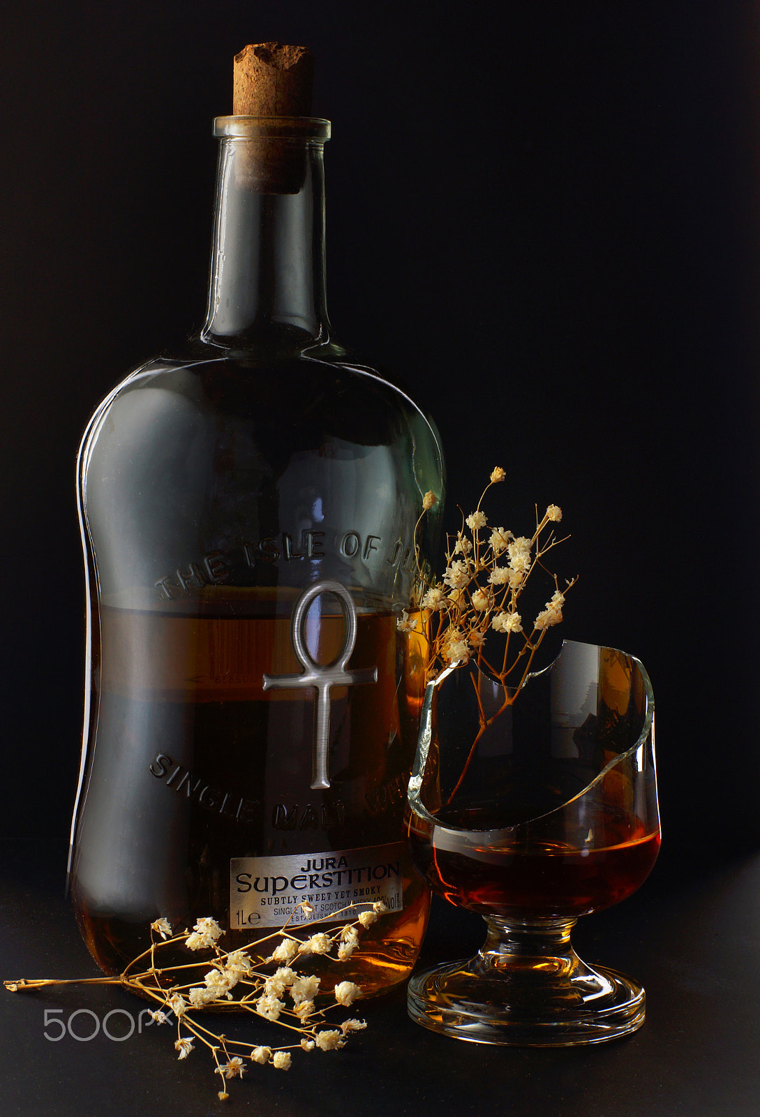 Minolta AF 50mm F1.4 [New] sample photo. Still-life from a bottle of whiskey, broken glass and dry flowers on a black background photography