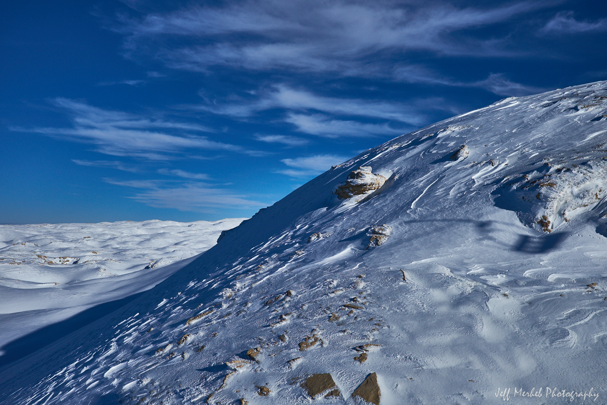 Fujifilm X-T10 + Fujifilm XF 23mm F2 R WR sample photo. Rocks on snow photography