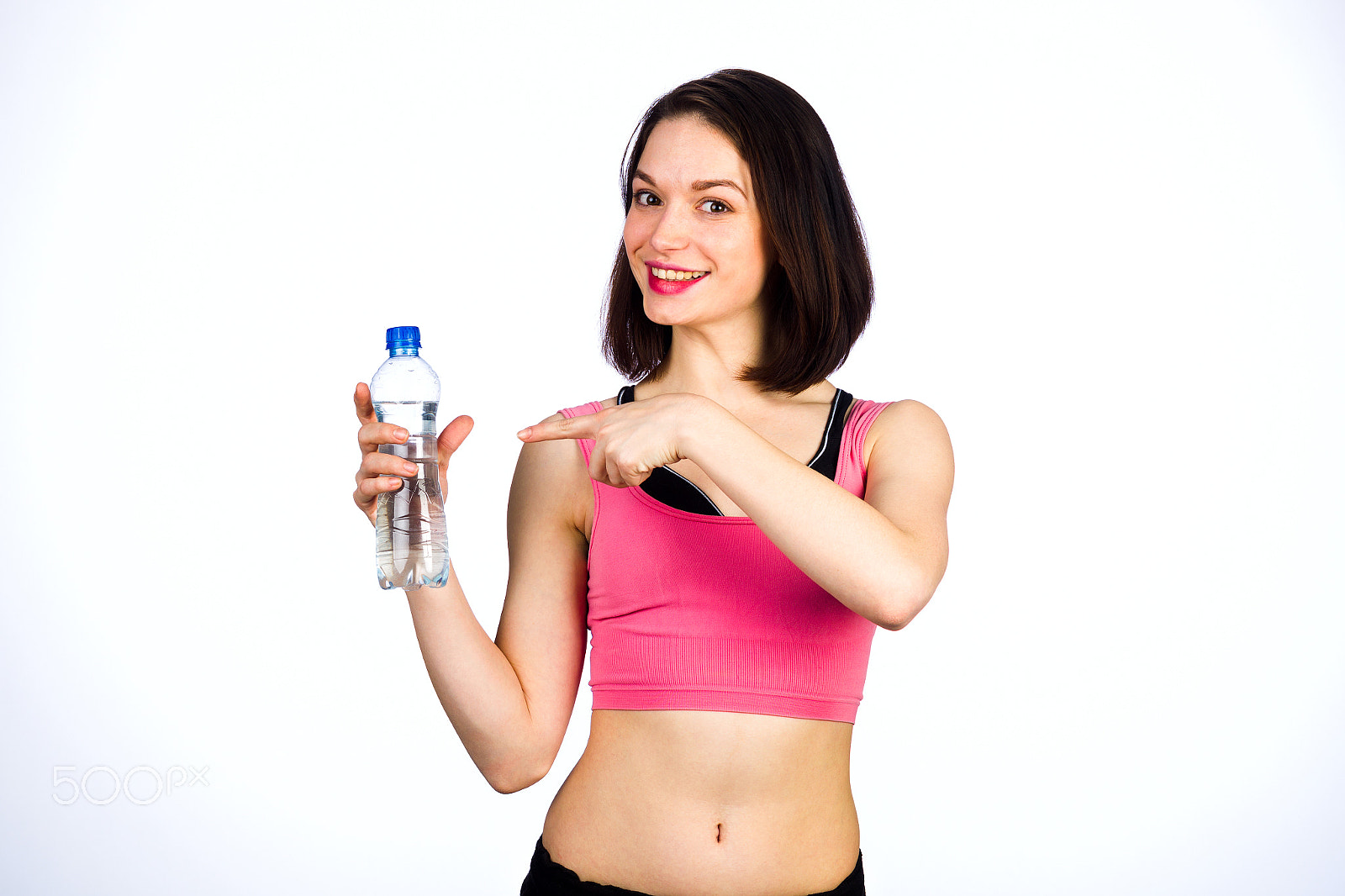 Canon EOS-1D Mark IV sample photo. Young woman in sportswear with a bottle of drinking water photography