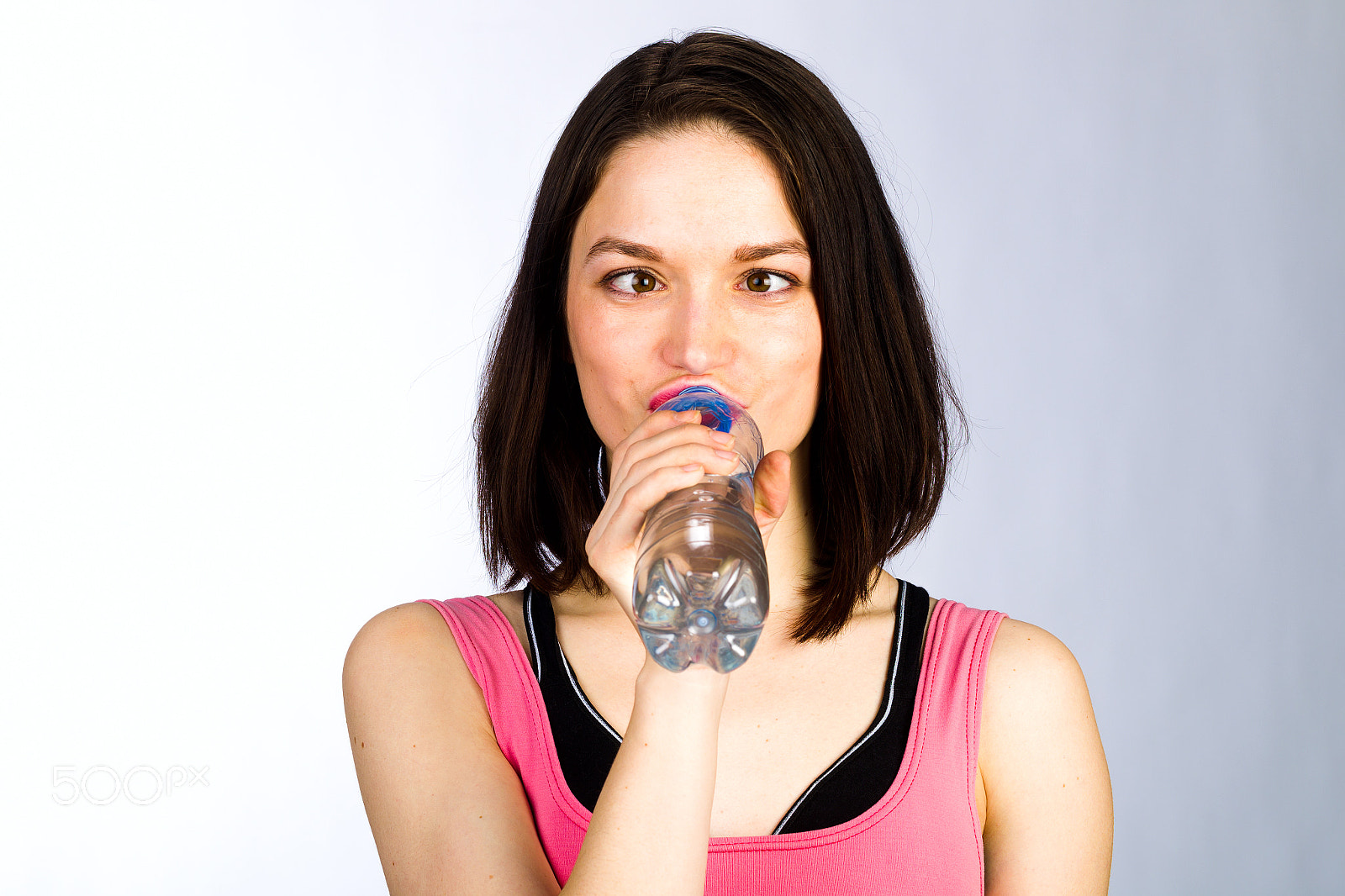 Canon EOS-1D Mark IV sample photo. Young woman in sportswear with a bottle of drinking water photography