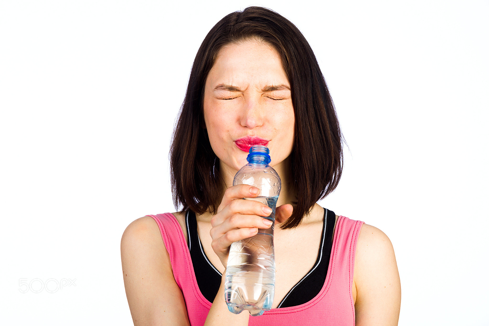 Canon EOS-1D Mark IV sample photo. Young woman in sportswear with a bottle of drinking water photography