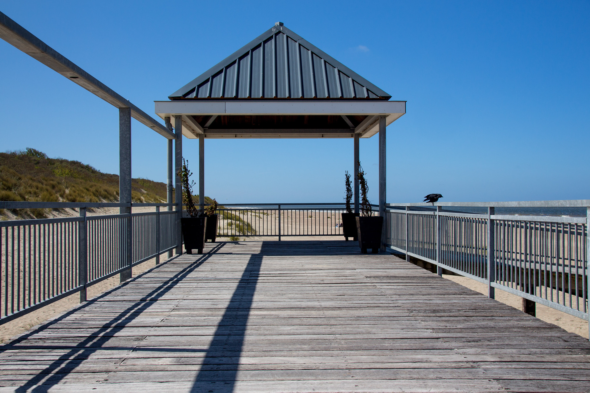 Sigma 18-250mm F3.5-6.3 DC OS HSM sample photo. Blue skies at the beach promenade photography