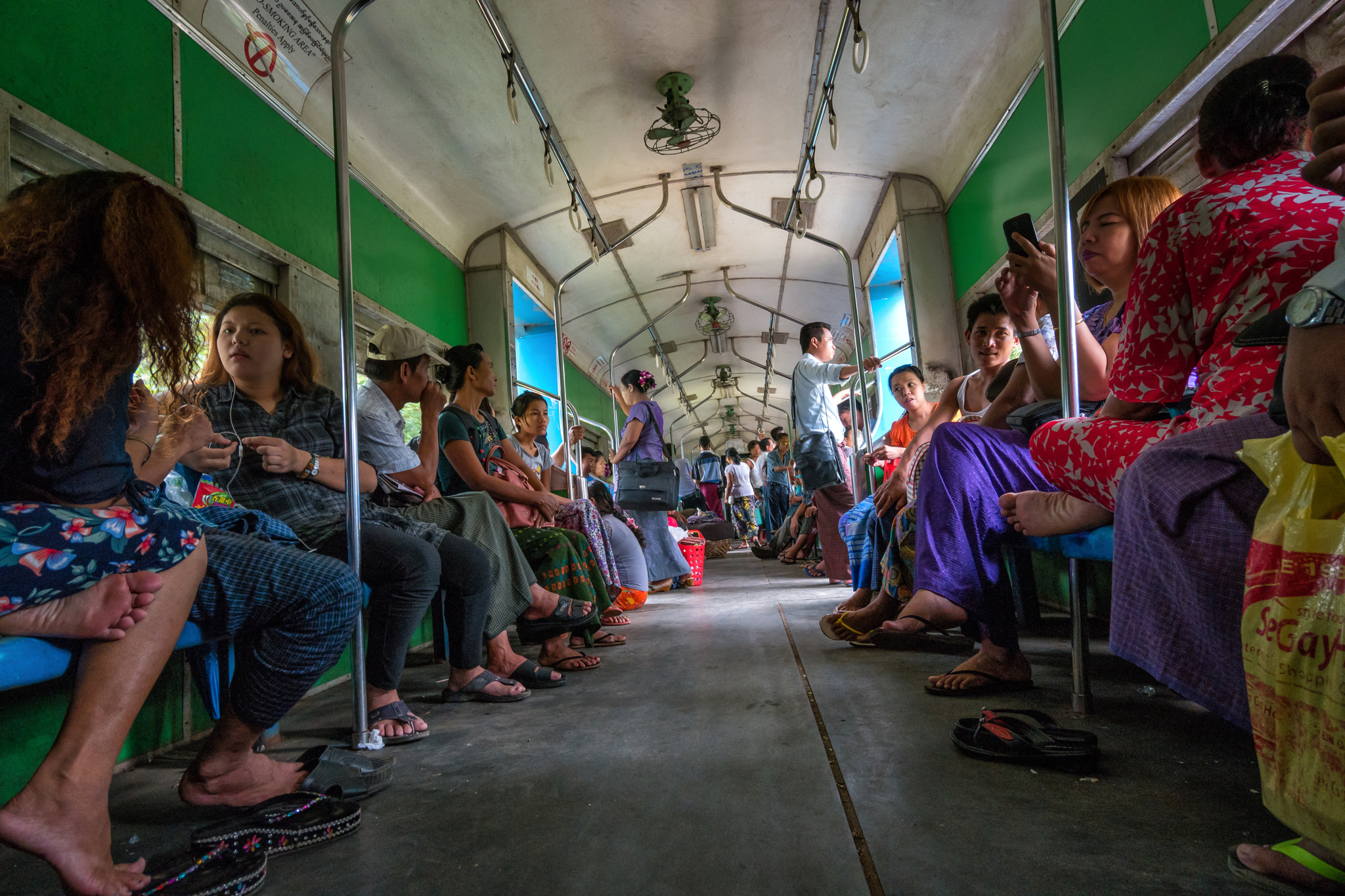 Samsung NX 12-24mm F4-5.6 ED sample photo. Riding the train, yangon myanmar photography