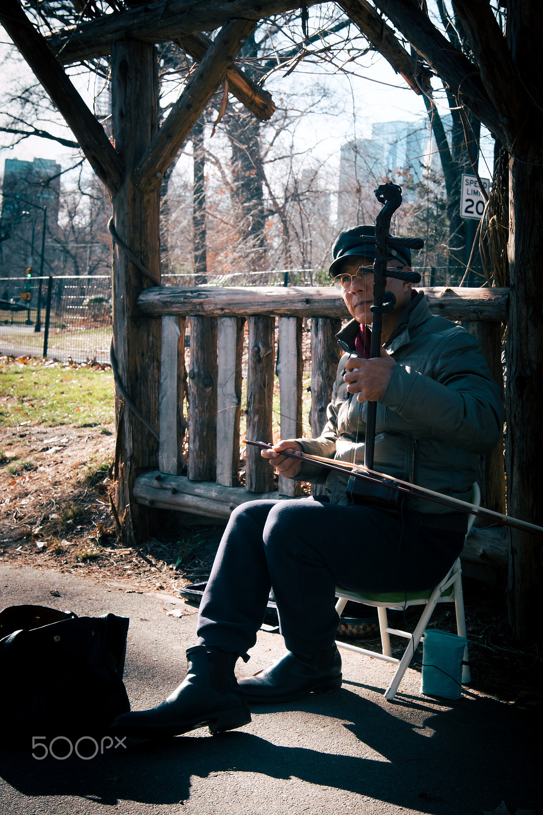 Sony ILCA-77M2 sample photo. Musician in central park photography